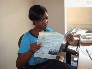 Samkeliso Ndlovu of ZAOGA is reading the first issue Set Alight magazine