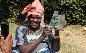 Amai Rwizi holding an award. Photo courtesy of Panorama Magazine