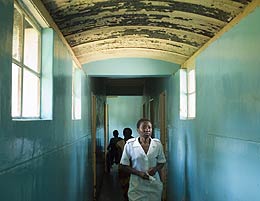 A nurse walks down a hallway connecting wards at the Howard Hospital. (Courtesy of Doug MacLellan)