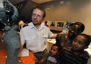 Guest speaker Dr. Paul Thistle and his wife Pedrinah and sons James, 11, and Alexander, 7, look at a Springstone stone sculpture on display from artist Letwin Mugavazi at the silent auction table during the Howard Hospital fundraiser on Thursday, June 21, 2012 at The Venue on George St. in Peterborough. Over 100 people were in attendance. CLIFFORD SKARSTEDT/PETERBOROUGH EXAMINER/QMI AGENCY
