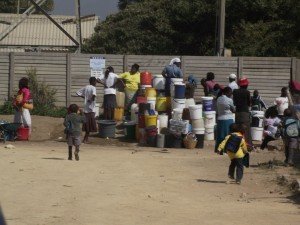 Residents fetching water in one of Harare's high density suburbs (M. Chibaya).